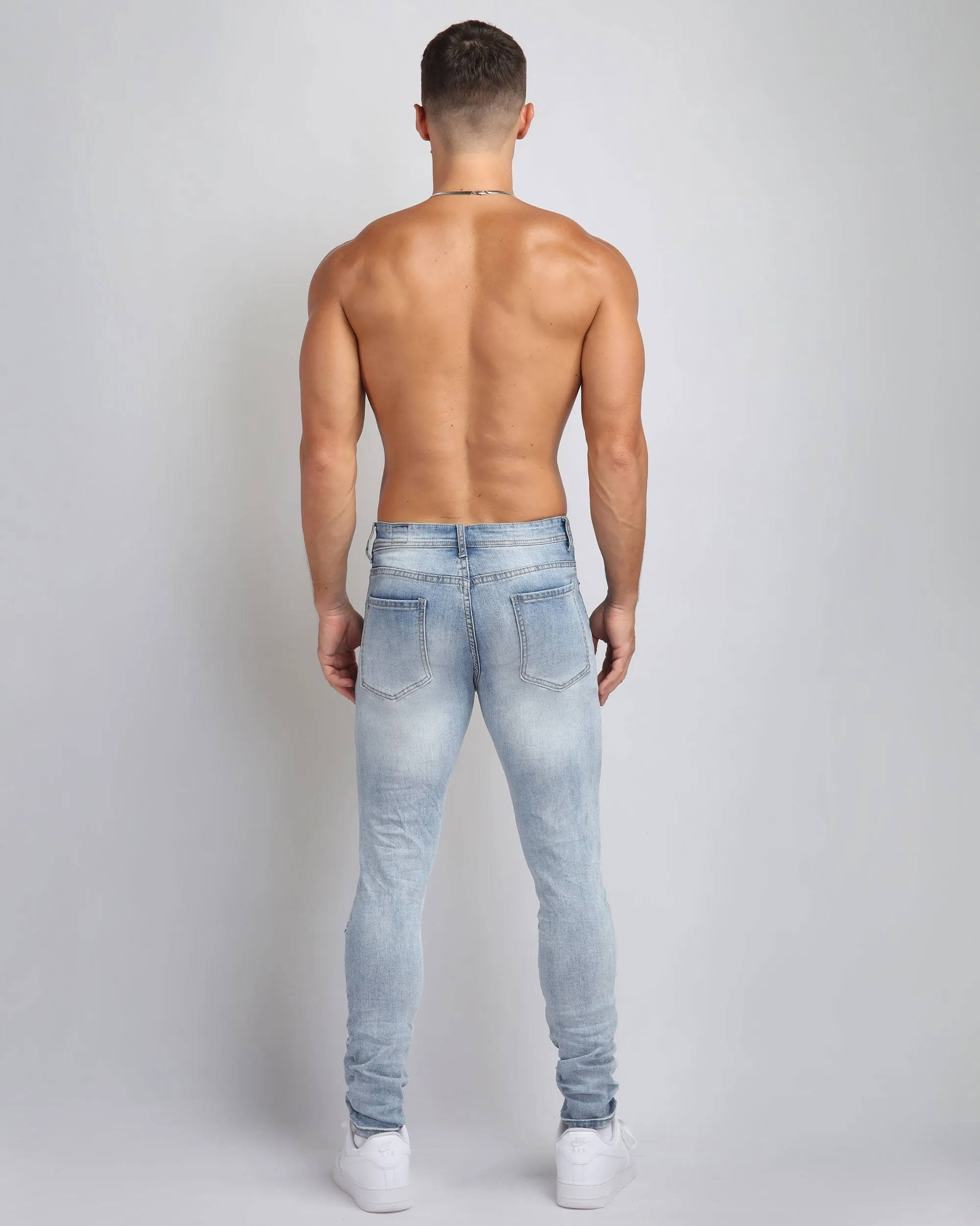 Large Ripped Blue Jeans with Skull Design